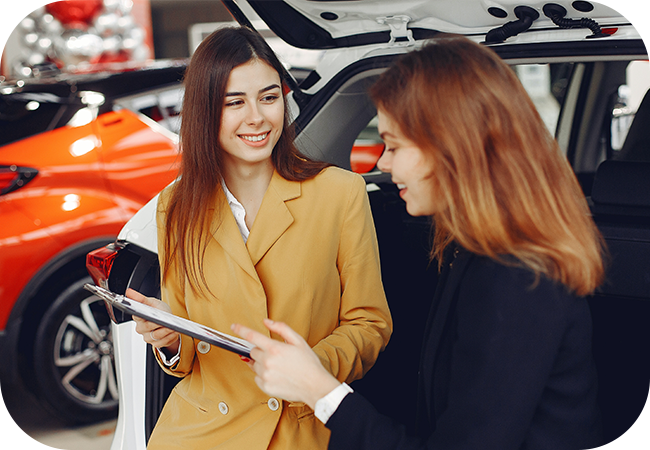 Two people discussing an automotive purchase