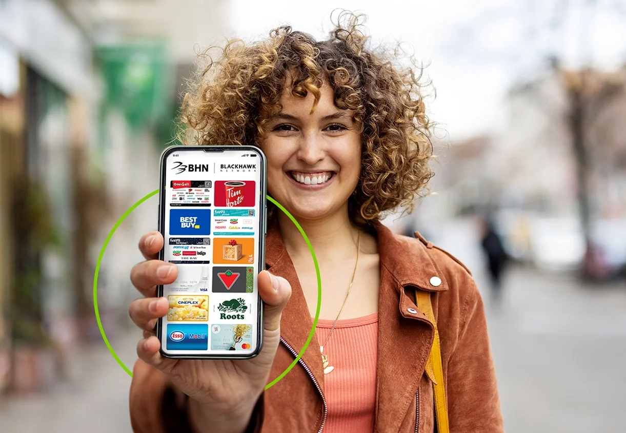 Person holding mobile gift cards